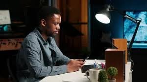 Guy scrolling their phone